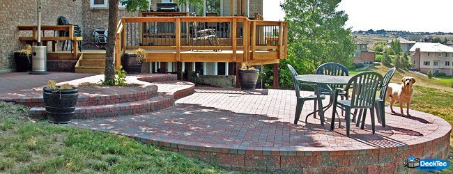 The combination of a wood deck and stone patio gives your homes exterior that bistro feeling and is the perfect place to enjoy a cup of coffee and catch up with the morning news.