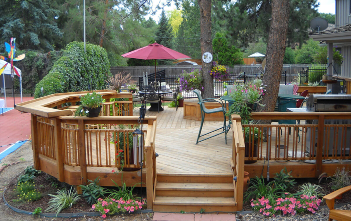 beautiful gardens surrounding a custom wood deck