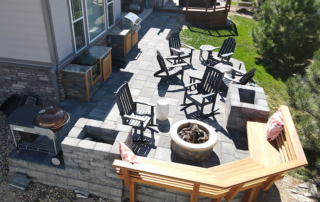 an overhead view of a paver patio and outdoor furniture