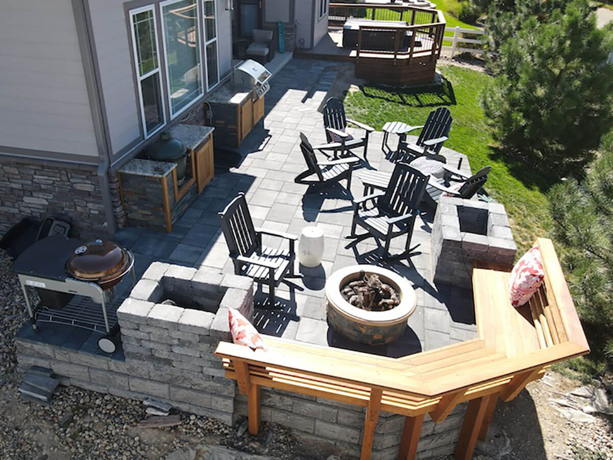 an overhead view of a paver patio and outdoor furniture