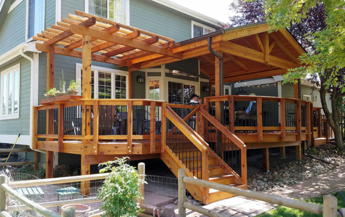 custom raised wood deck, railings, roof cover, and pergola