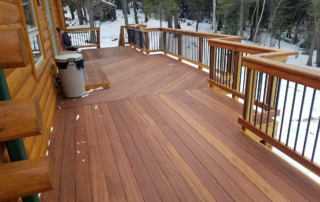 a custom wood deck cleared of recent snow