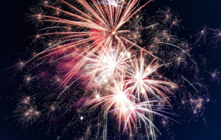 fireworks exploding in a dark sky