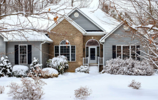 a winter scenario with snow surrounding a house