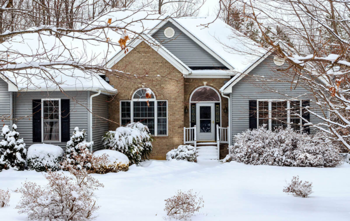 a winter scenario with snow surrounding a house