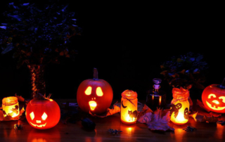 lit jack-o-lanterns in the dark