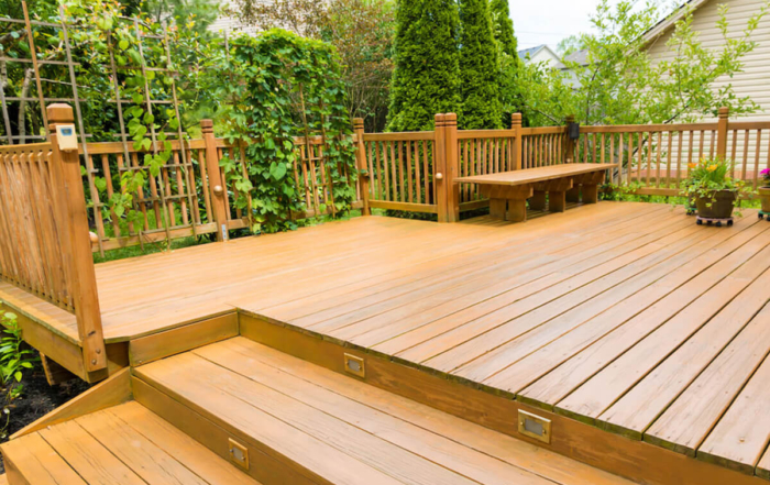 custom wood deck with benches and railings