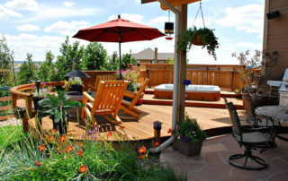 custom wood deck with railings and hottub