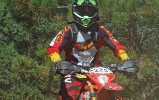 a dirtbike rider with protective gear