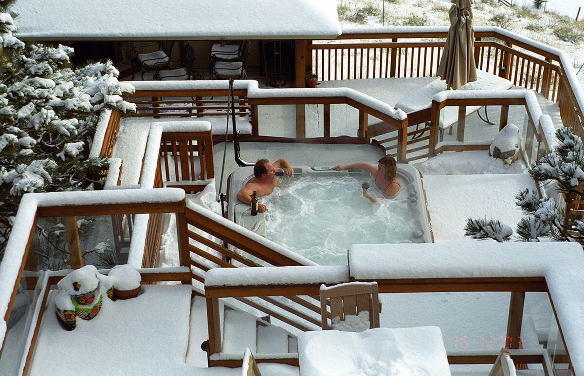 having a drink in a snowy spa environment
