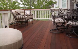 beautifully stained deck with painted railings