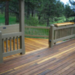 wood stained deck with painted rails
