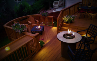 a wood deck in the dark with fire features