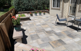 modern paver patio with built-in plantars