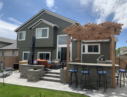 The Ultimate Outdoor Retreat: This Littleton, Colorado Stone Patio Features a Hot Tub, Grill, Pergola & Firepit