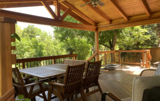 custom wood deck with a roof cover