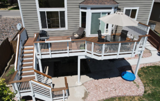 elevated wood deck with a custom staircase