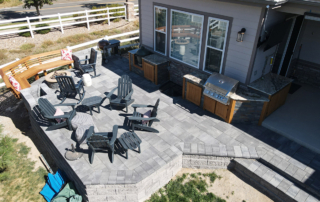 overview of a paver patio with an outdoor kitchen