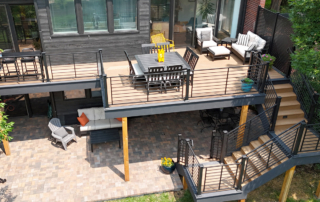 overview of an elevated deck above a paver patio