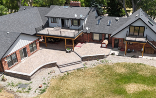 2 decks overlooking a large paver patio