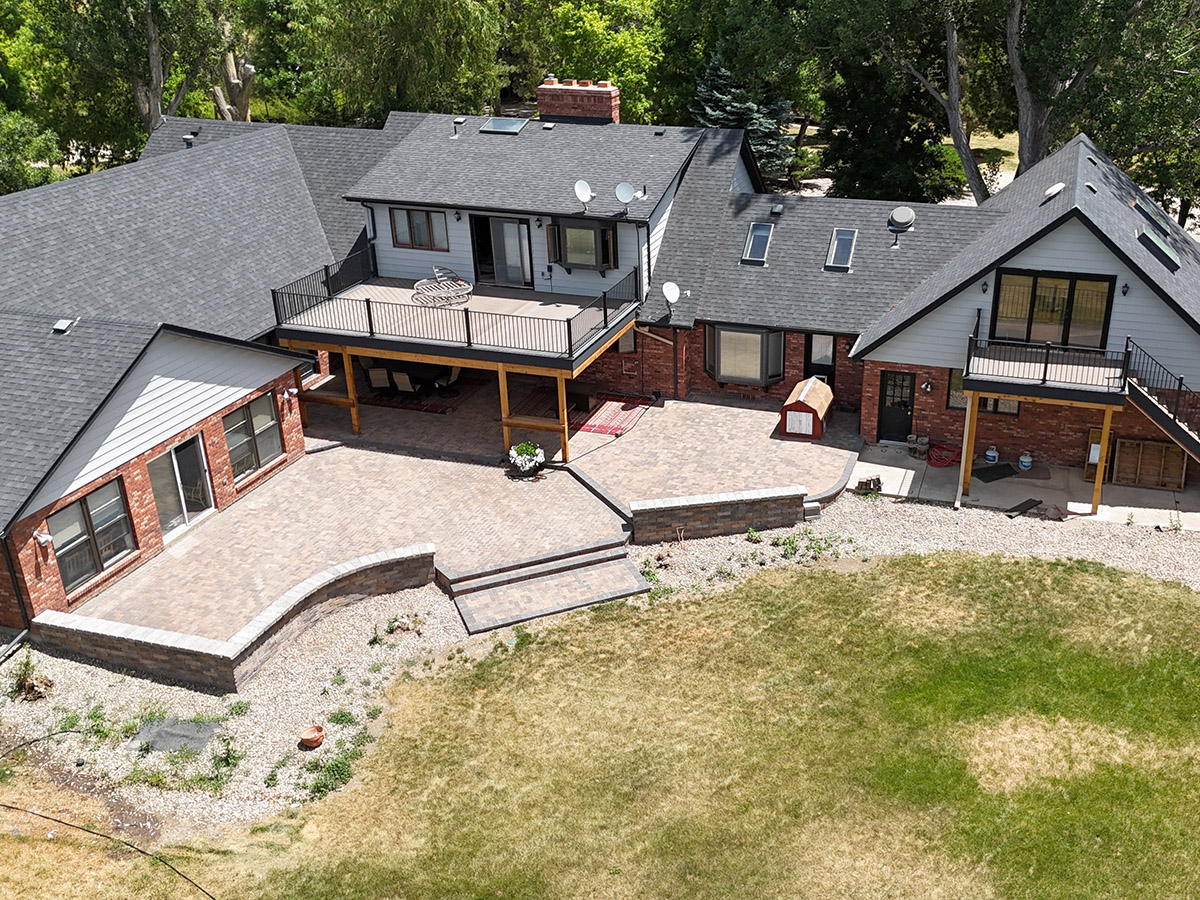 2 decks overlooking a large paver patio