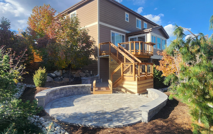 custom multi-level wood deck attached to a paver patio