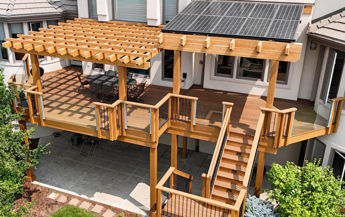 custom wood deck with pergola and solar panels